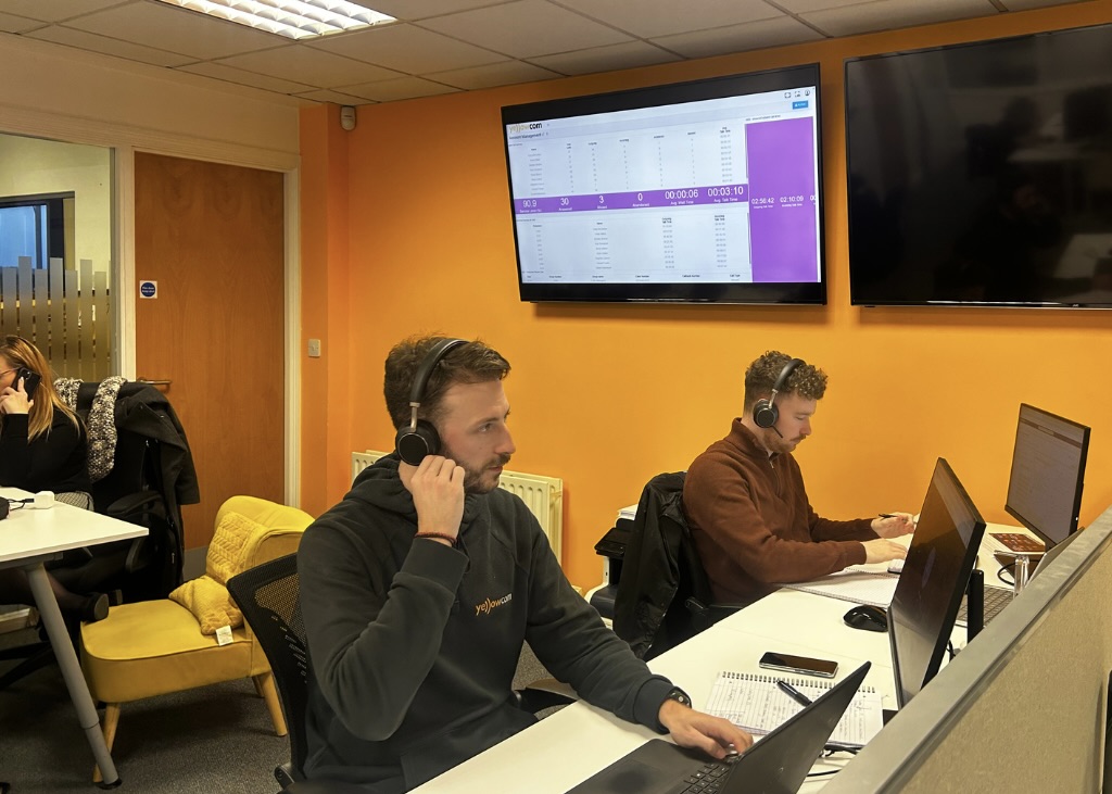 A member of the YWeb team at their desk
